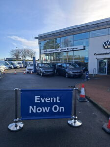 Event Now On banner with chrome posts at Volkswagen Van Centre Glasgow